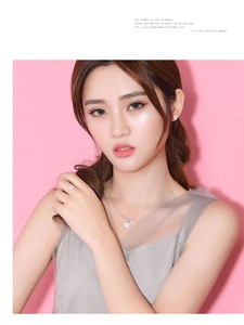 Detailed view of elegant cherry blossom jewelry set with crystals worn by model