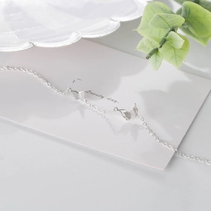 Minimalist S925 sterling silver bracelet featuring two elegant butterfly charms on fine chain
