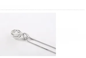 Macro shot of S925 sterling silver chain with a hollow cross pendant and polished finish