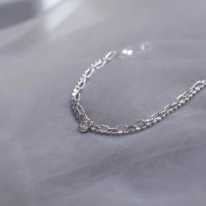 Elegant double-layered S925 sterling silver chain bracelet with round embossed charm
