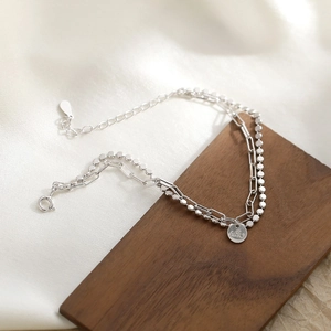 Double-layer S925 sterling silver paperclip bracelet with a lucky round charm tag
