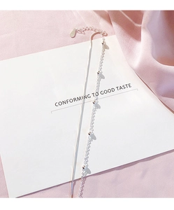 Detail of S925 silver double-layer bracelet with sleek snake chain and delicate beads