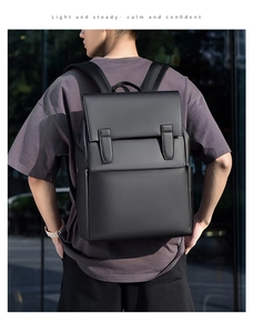 Business laptop backpack in black leather with dual straps and modern urban aesthetic