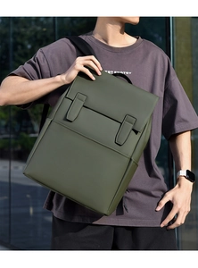 Olive green minimalist commuter backpack with waterproof fabric and vertical strap detail