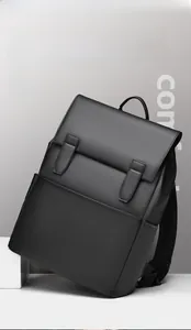 Detail view of black matte leather backpack featuring flip cover and vertical straps