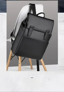 Detail of minimalist black business backpack with matte finish and dual strap flap closure