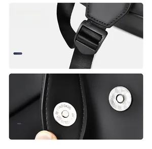 Detail view of adjustable metal buckle and magnetic snap closure on black business backpack