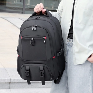 Detail of black travel backpack showing adjustable straps and durable mesh side pockets
