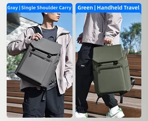 Waterproof business backpack in gray and green showing shoulder and hand-carry modes
