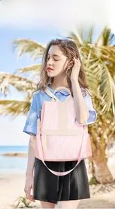 Pink quilted fashion backpack for women shown in a tropical beach vacation setting