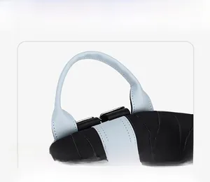 Detail of ergonomic contrast color handle on a stylish black and blue backpack