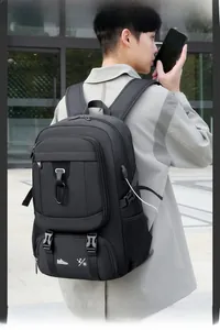 Detail of travel backpack showing side USB charging port and functional buckle straps