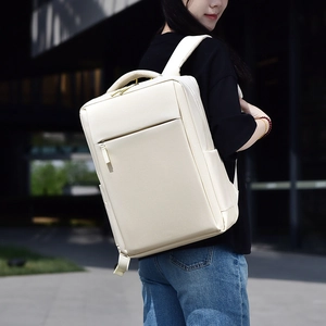 Outdoor view of a minimalist cream business backpack with breathable mesh shoulder straps