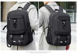 Detail of multi-functional black travel backpack showing shoe compartment and side buckles