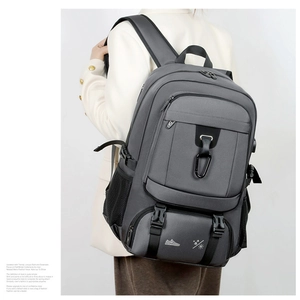 Detail view of large capacity travel backpack with side straps and durable zippers
