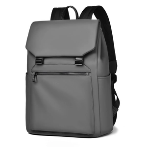 Waterproof grey business travel backpack for men shown from a 45-degree side angle
