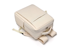 Detail view of breathable honeycomb mesh padding on beige ergonomic laptop backpack