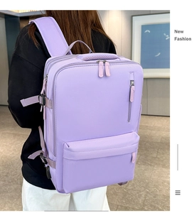 Rear view of lavender purple nylon backpack showing multi-zipper layers and handle detail