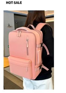 Pink multi-compartment nylon backpack with adjustable buckles and wide straps
