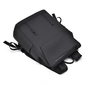 Top view of a black waterproof backpack featuring matte finish and multiple zip pockets