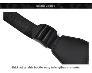 Detail of adjustable black nylon shoulder strap with heavy-duty buckle and reinforced stitching