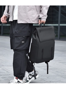 Waterproof black urban backpack featuring multiple zippers and matte minimalist finish