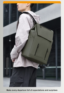 Outdoor urban shot of a minimalist olive green waterproof backpack with multi-zipper pockets
