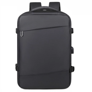Expandable business laptop backpack in matte black with USB charging port and sleek design