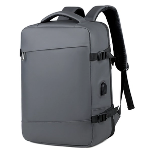 Detail view of water-resistant business backpack with side buckle and USB charging port