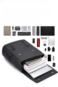 Detailed top view of high-capacity black backpack with organized laptop compartments