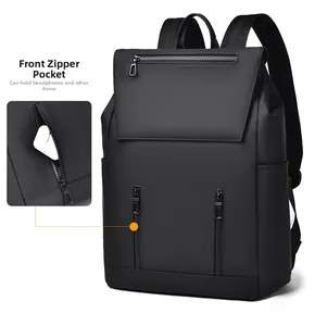 Detail view of front zipper pocket on black backpack storing wireless earphones