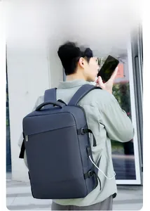 Close-up of side profile showing USB charging port and buckles on water-resistant backpack