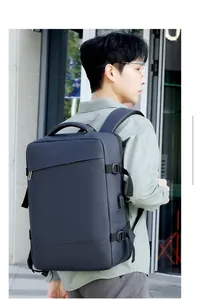 Business laptop backpack with USB port and adjustable side straps in outdoor city setting