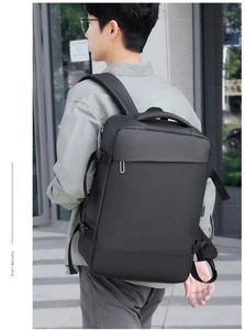 Detail of ergonomic S-shaped shoulder straps and waterproof matte fabric on business backpack