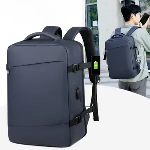 Detail of navy business backpack featuring side USB charging port and adjustable buckles