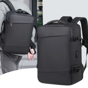 Detail view of business backpack with side USB port, reinforced handle and compression straps