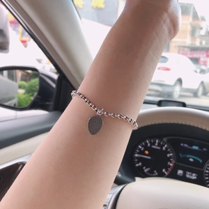Minimalist S925 sterling silver chain bracelet featuring a delicate leaf-shaped pendant
