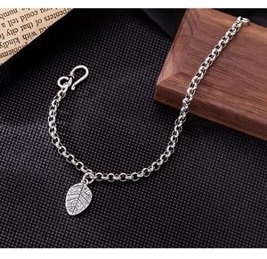 Detailed close-up of a vintage S925 silver leaf pendant chain with an S-hook closure