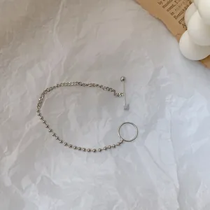 Detail of silver S925 beaded chain bracelet with modern OT toggle clasp closure
