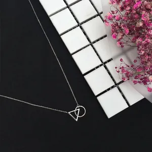 Minimalist S925 silver necklace with geometric ring and triangle pendant design