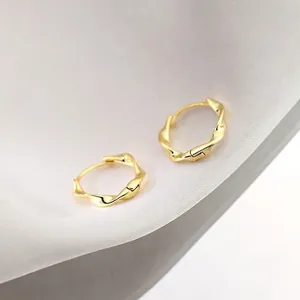 Golden Mobius twist hoop earrings with textured rope design in a high-polished finish