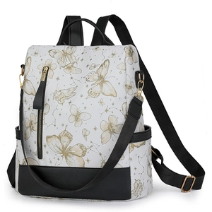 Detailed close-up of butterfly embroidery and golden hardware on the nylon backpack