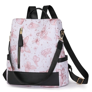 Close-up of butterfly pattern nylon backpack with black faux leather trim and metal zipper