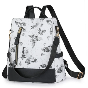 Macro detail of high-quality embroidered nylon backpack with butterfly and constellation patterns