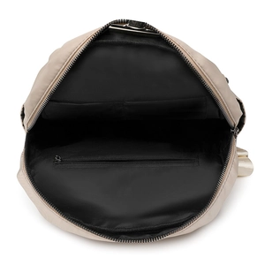 Detailed interior view of a beige large capacity anti-theft oxford cloth backpack pockets