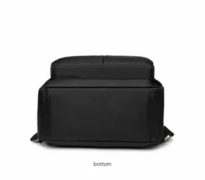 Detail view of the flat bottom structure and stitching on a black oxford backpack