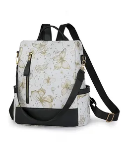 Detail of white nylon backpack with gold butterfly print and black adjustable straps