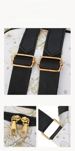Detailed view of adjustable shoulder strap and gold zipper on white butterfly printed bag