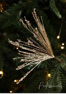 Close-up of sparkling champagne gold sequin decorative branch for Christmas tree decor