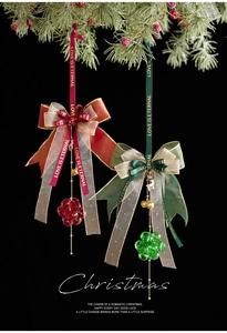 Detailed view of red and green velvet bows with crystal beads for Christmas tree decor